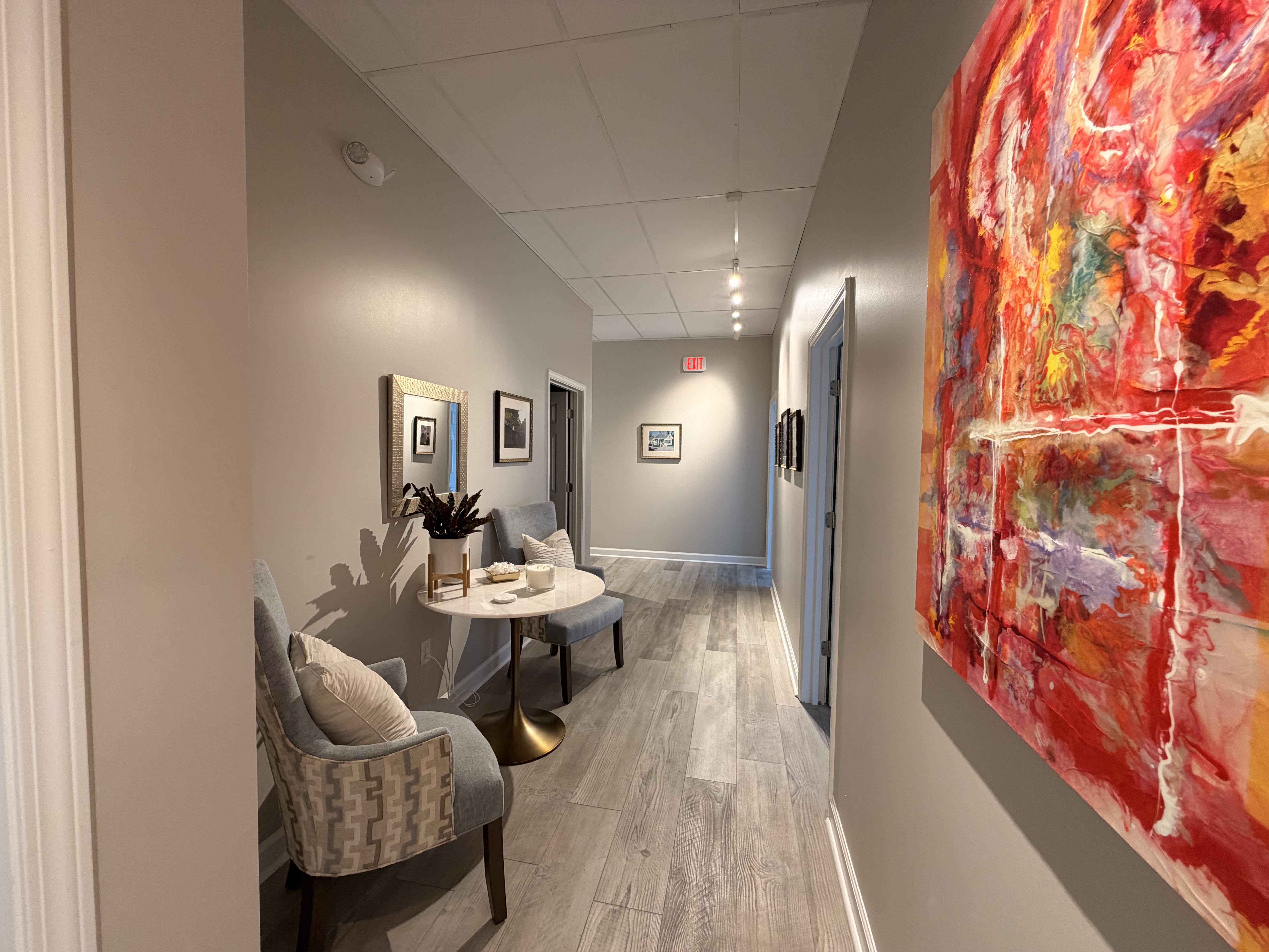 Bright, gallery-like hallway with curated artwork