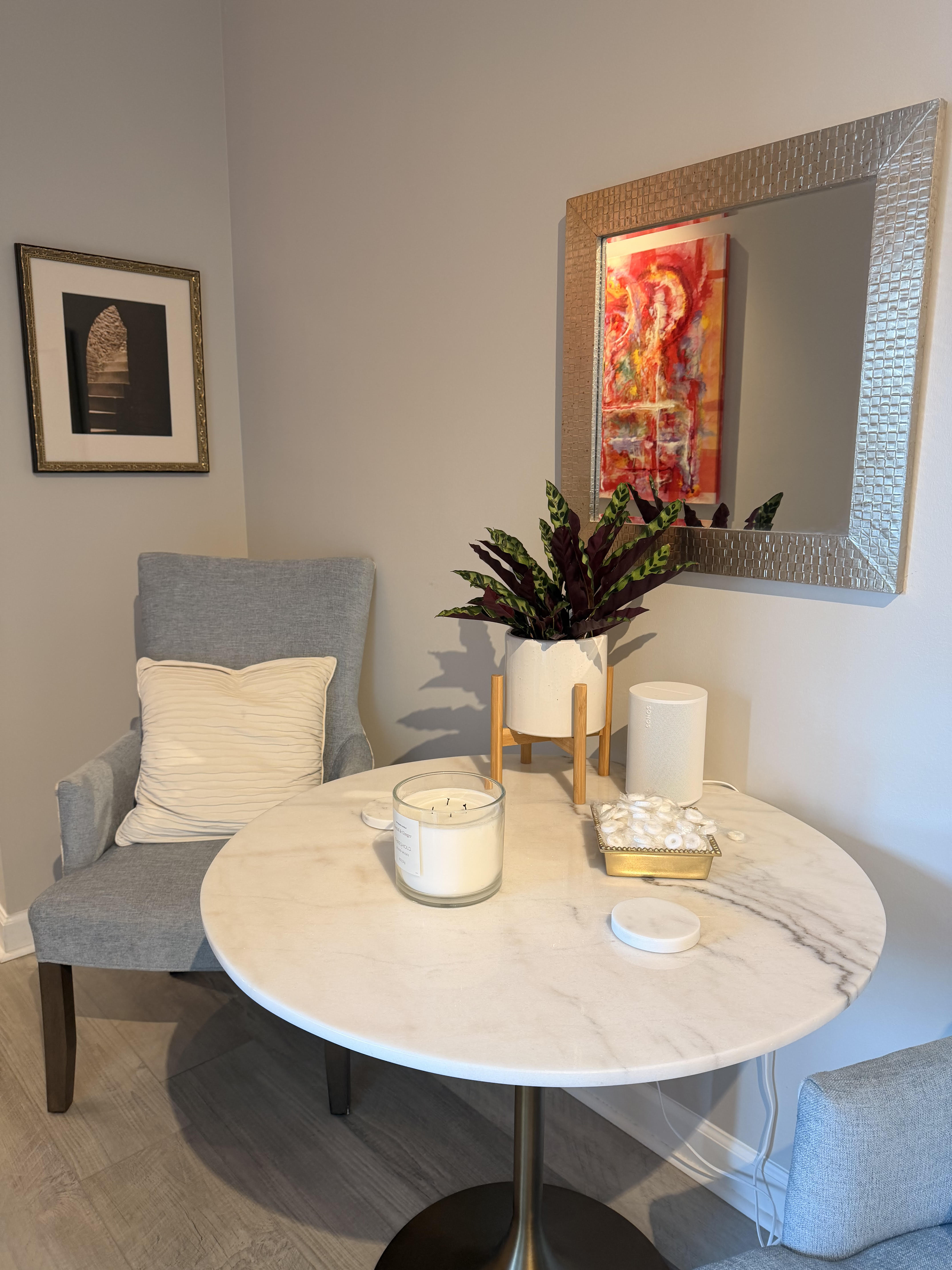 Welcoming corner nook with accent chair and marble table
